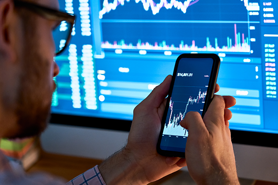 trader-using-mobile-phone-app-analytics-for-stock-2022-02-04-12-45-30-utc